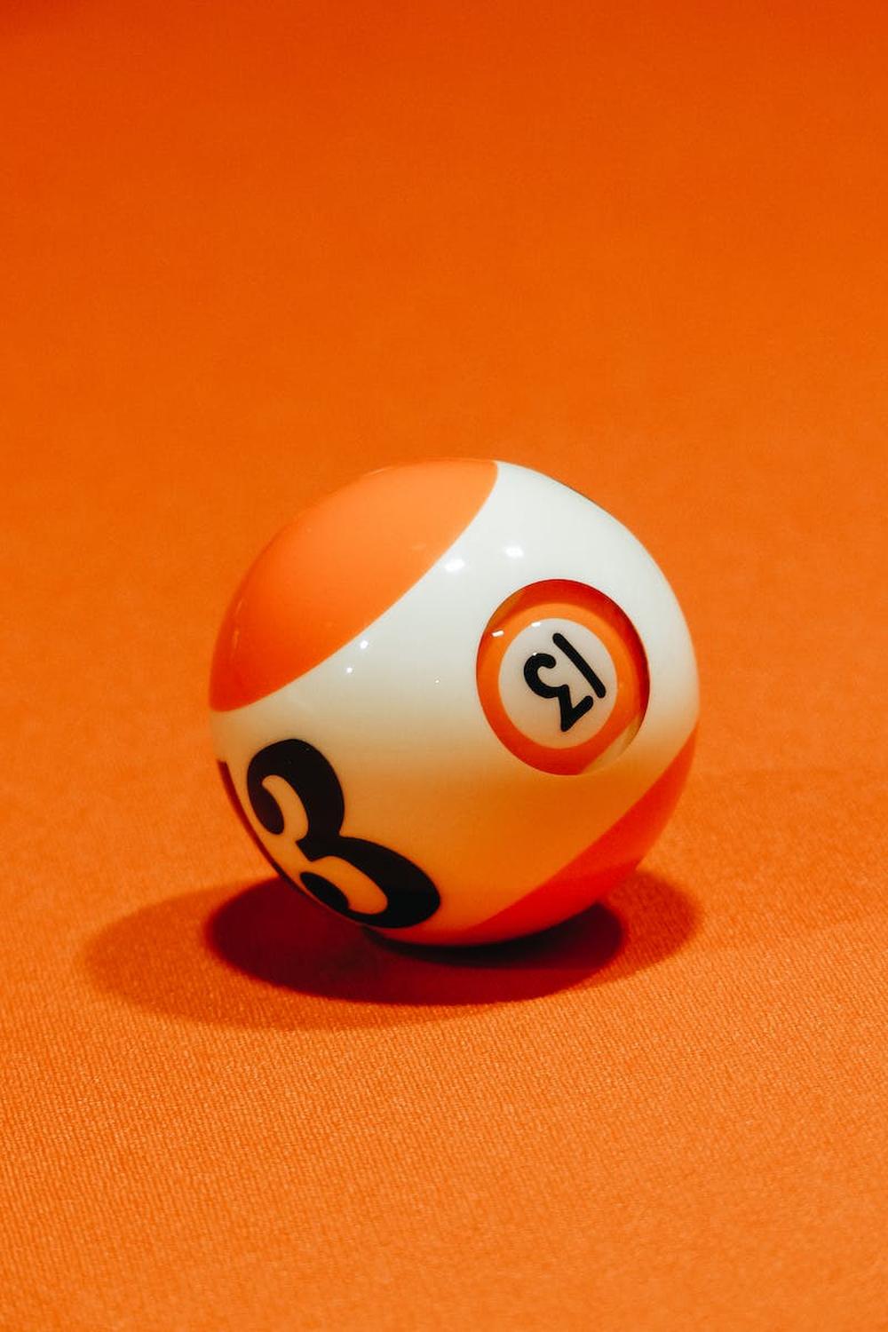 billiard_ball_on_bright_orange_surface