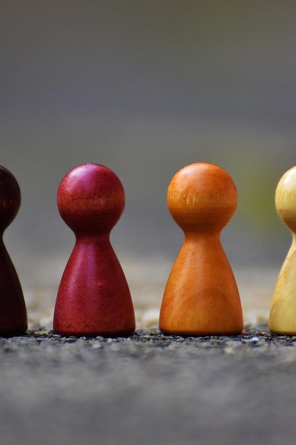 focus_photo_of_4_wooden_pawn_figurine