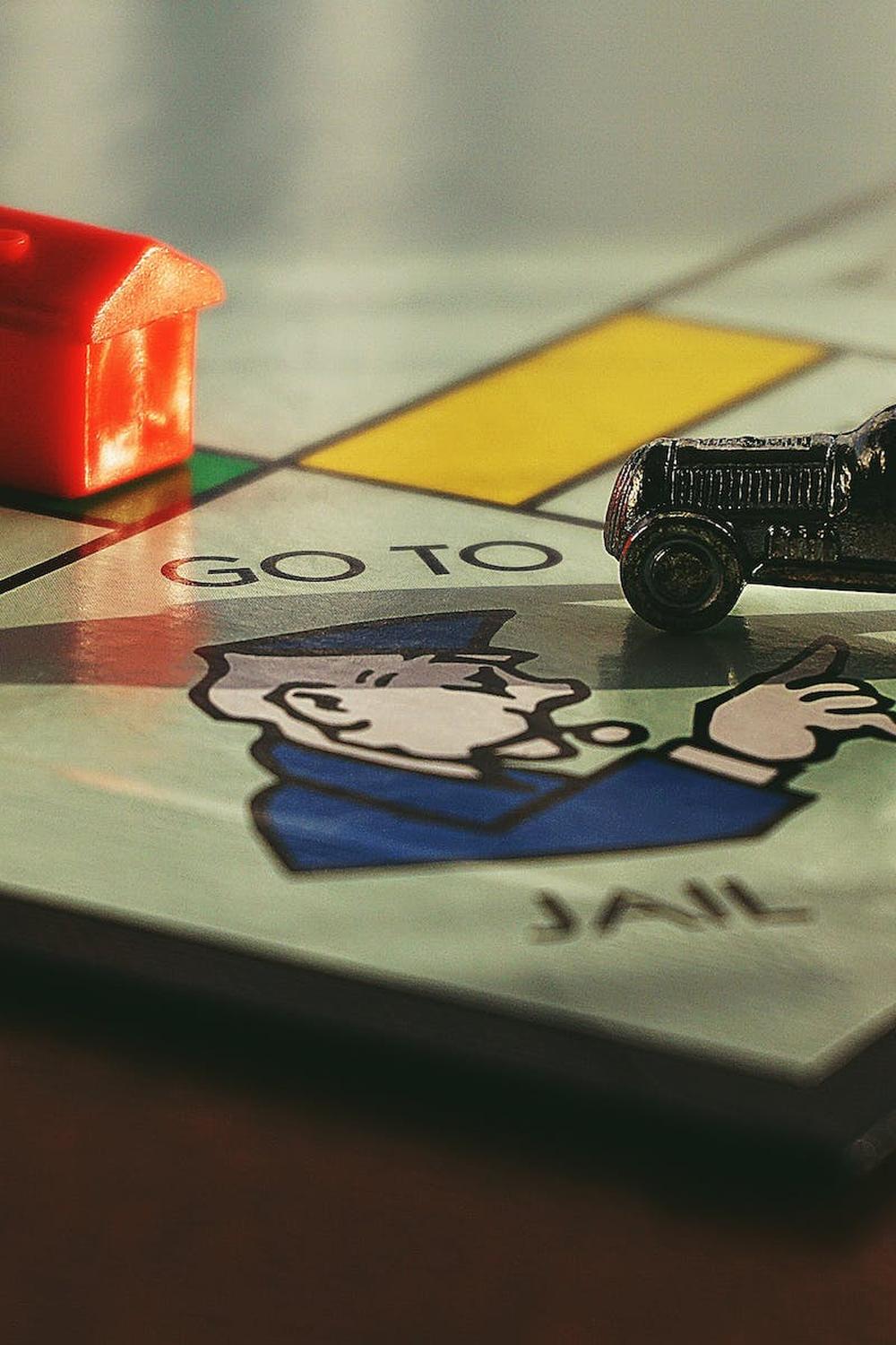 miniature_toy_car_on_monopoly_board_game