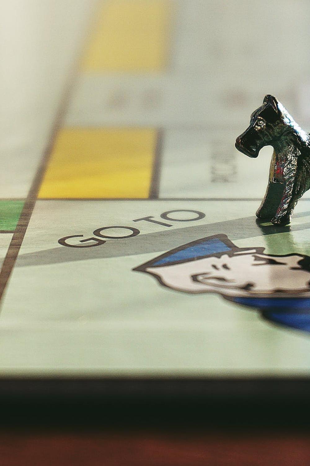 miniature_toy_on_monopoly_board_game
