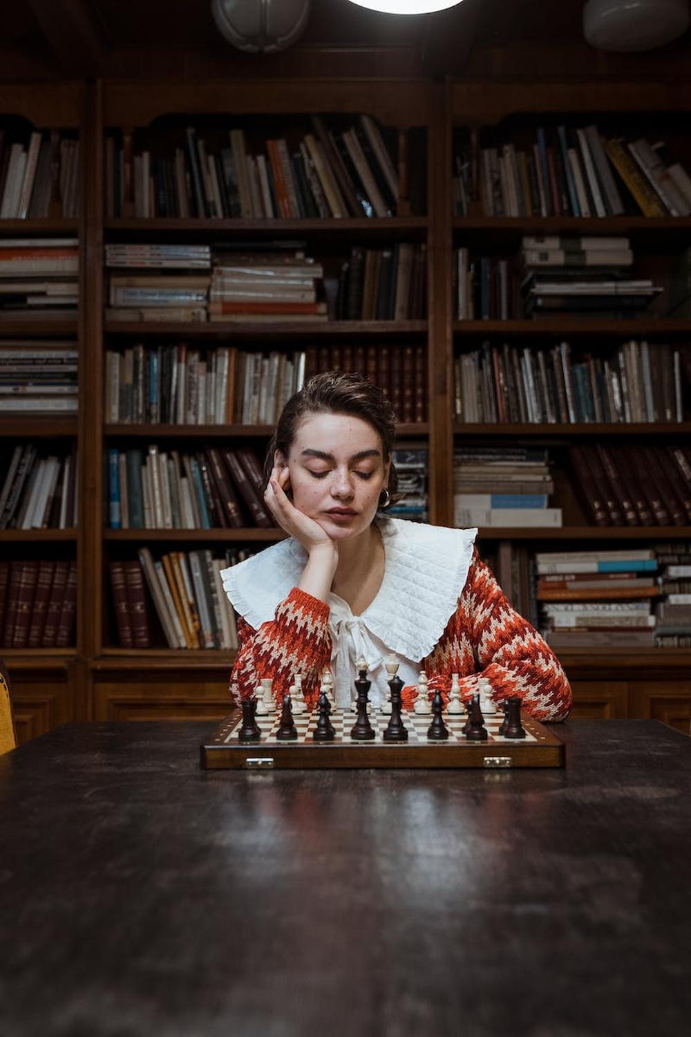 pensive_woman_playing_chess