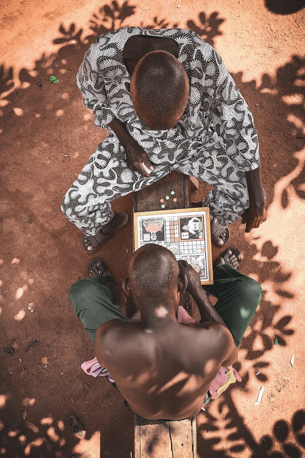 top_view_photo_of_men_playing_board_game