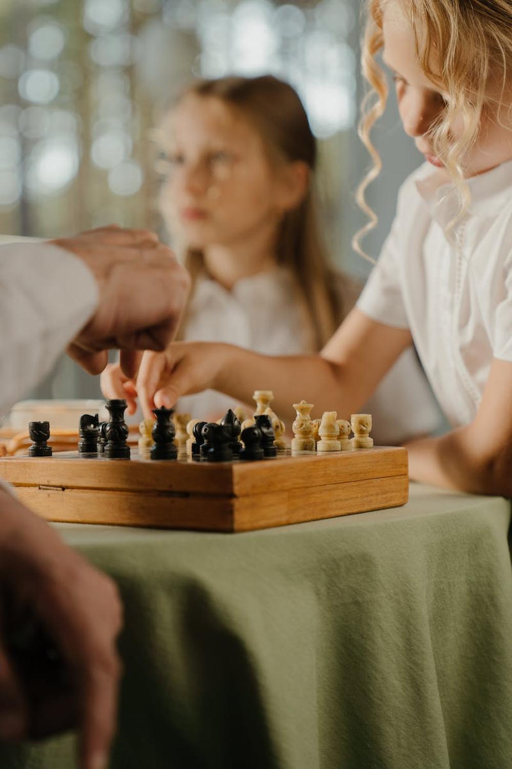 young_girl_playing_chess_with_a_man